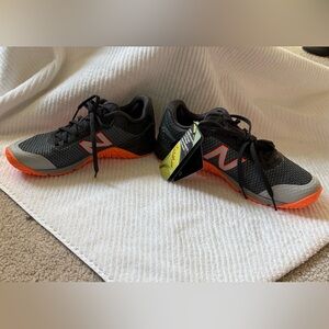 Women’s  Rapid Rebound New Balance Black and Orange Athletic Sneakers